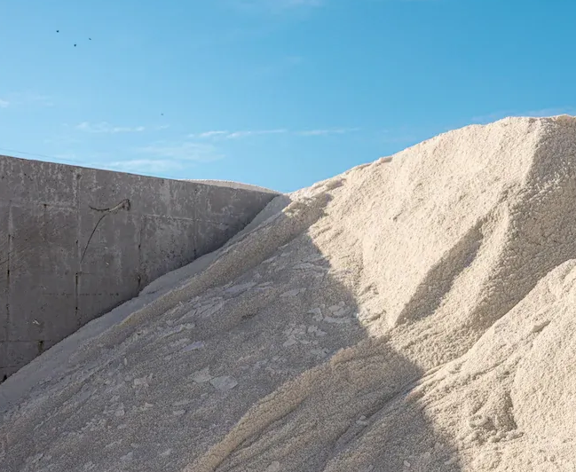 A close up of a pile of dirt on a white plate.