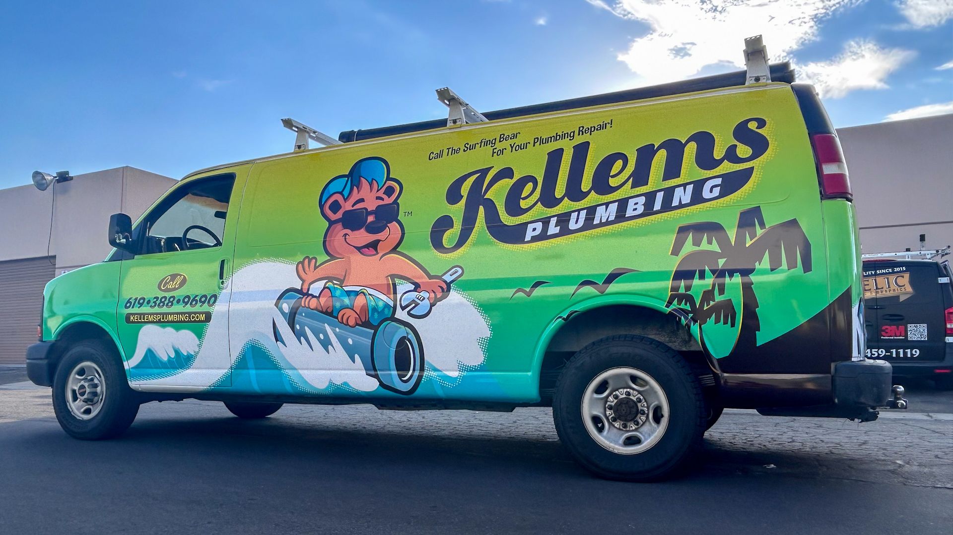 Kellems Plumbing van with cartoon bear surfing, on a green and yellow background.