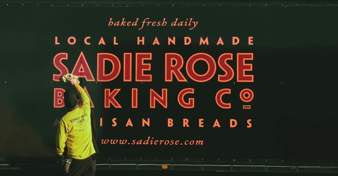 Person in yellow shirt painting the 