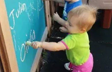 Toddlers Writing on the Board — Fort Thomas, KY — Kids & Cribs Early Childhood Enrichment Center