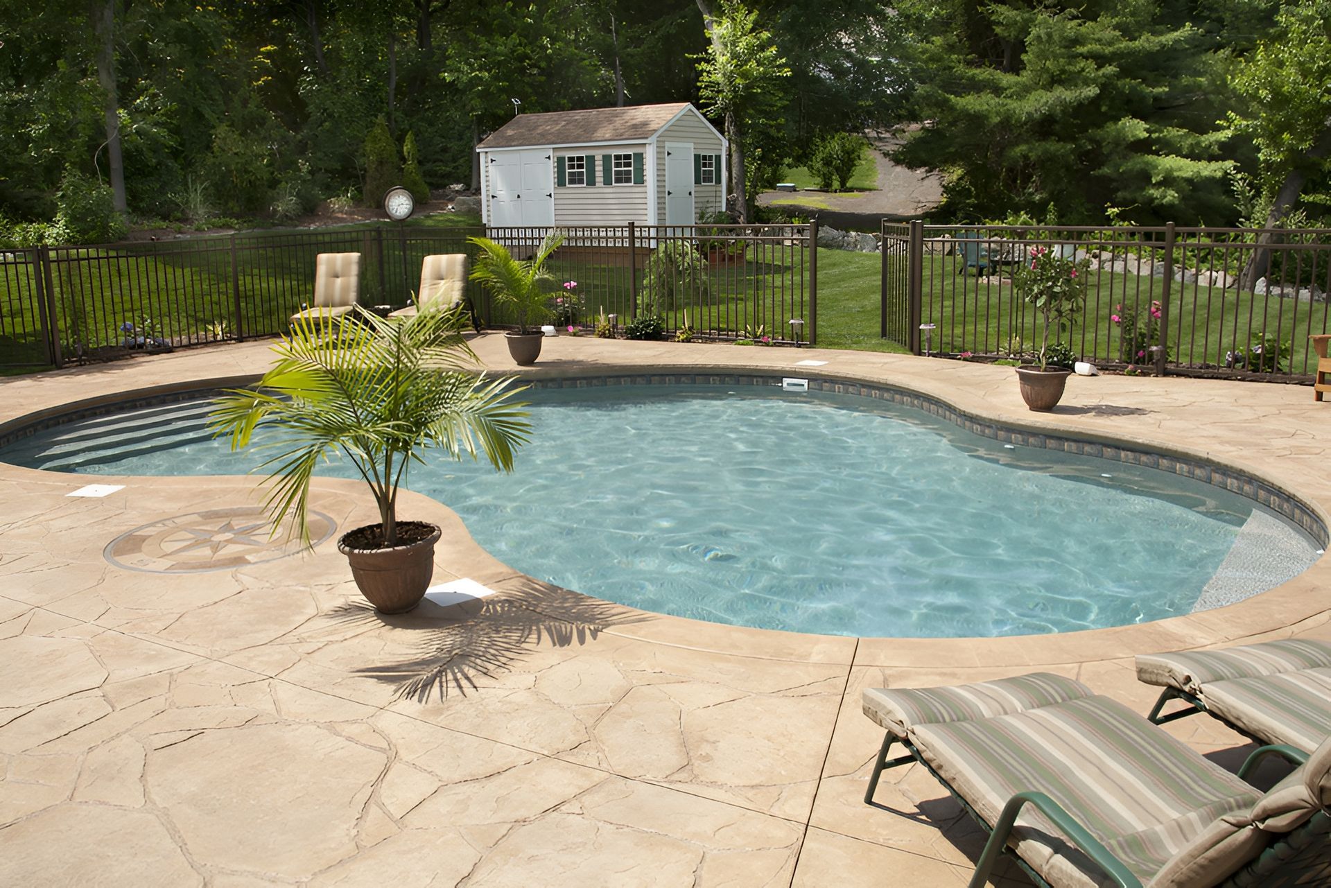 Backyard Pool With Surrounding Patio — Landsborough Pool Supplies & Service in Glass House Mountains, QLD