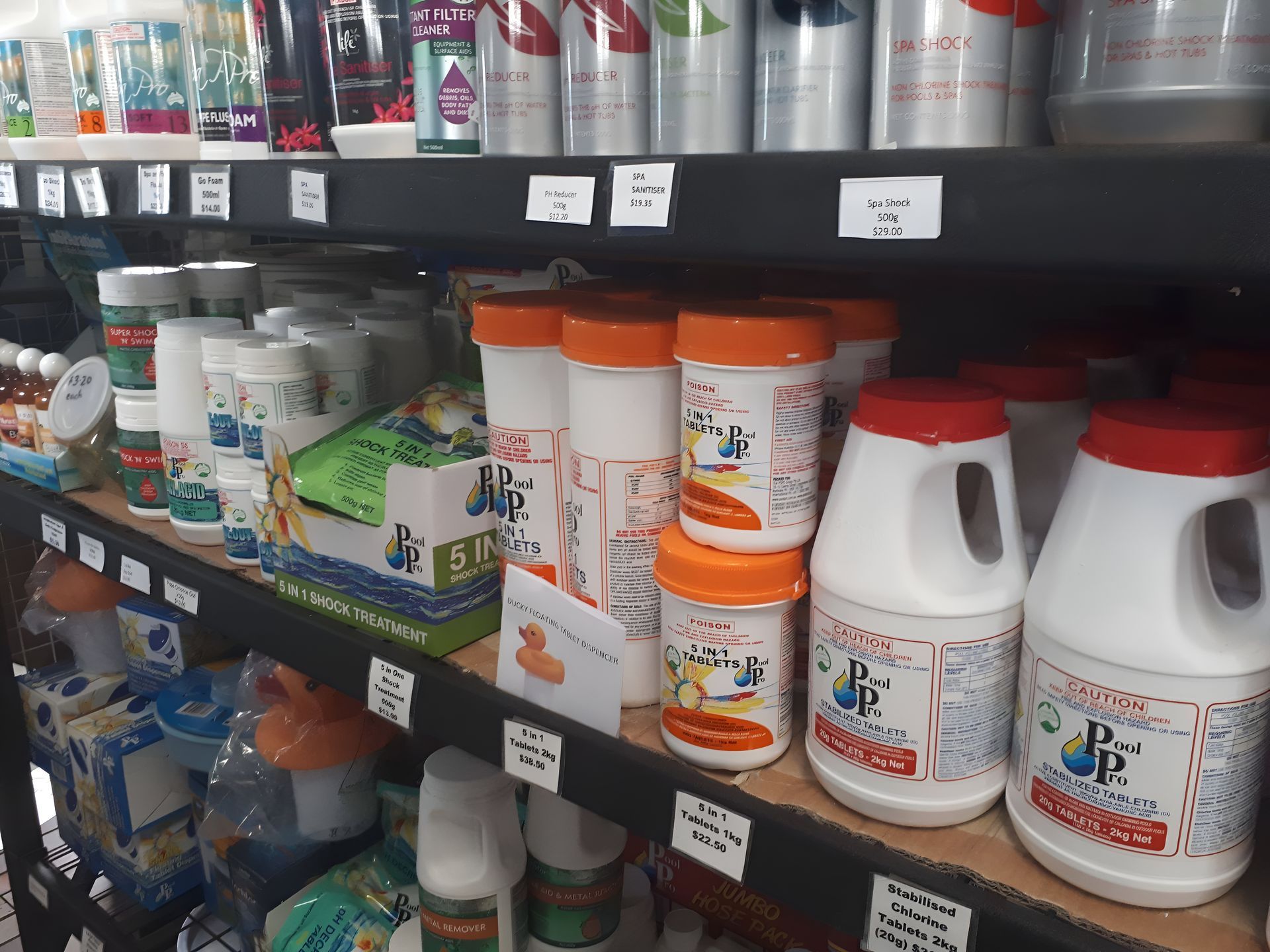 Shelves Stocked With Various White and Orange — Landsborough Pool Supplies & Service in Mooloolah Valley, QLD