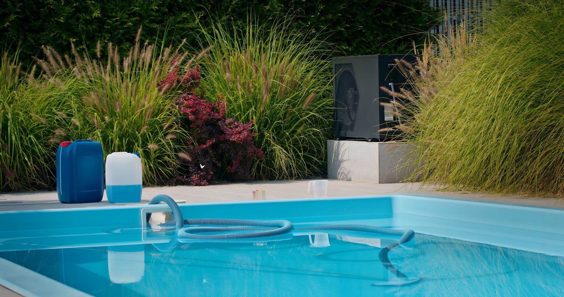 Poolside Scene: Blue Pool With Cleaning Supplies — Landsborough Pool Supplies & Service in Caloundra, QLD