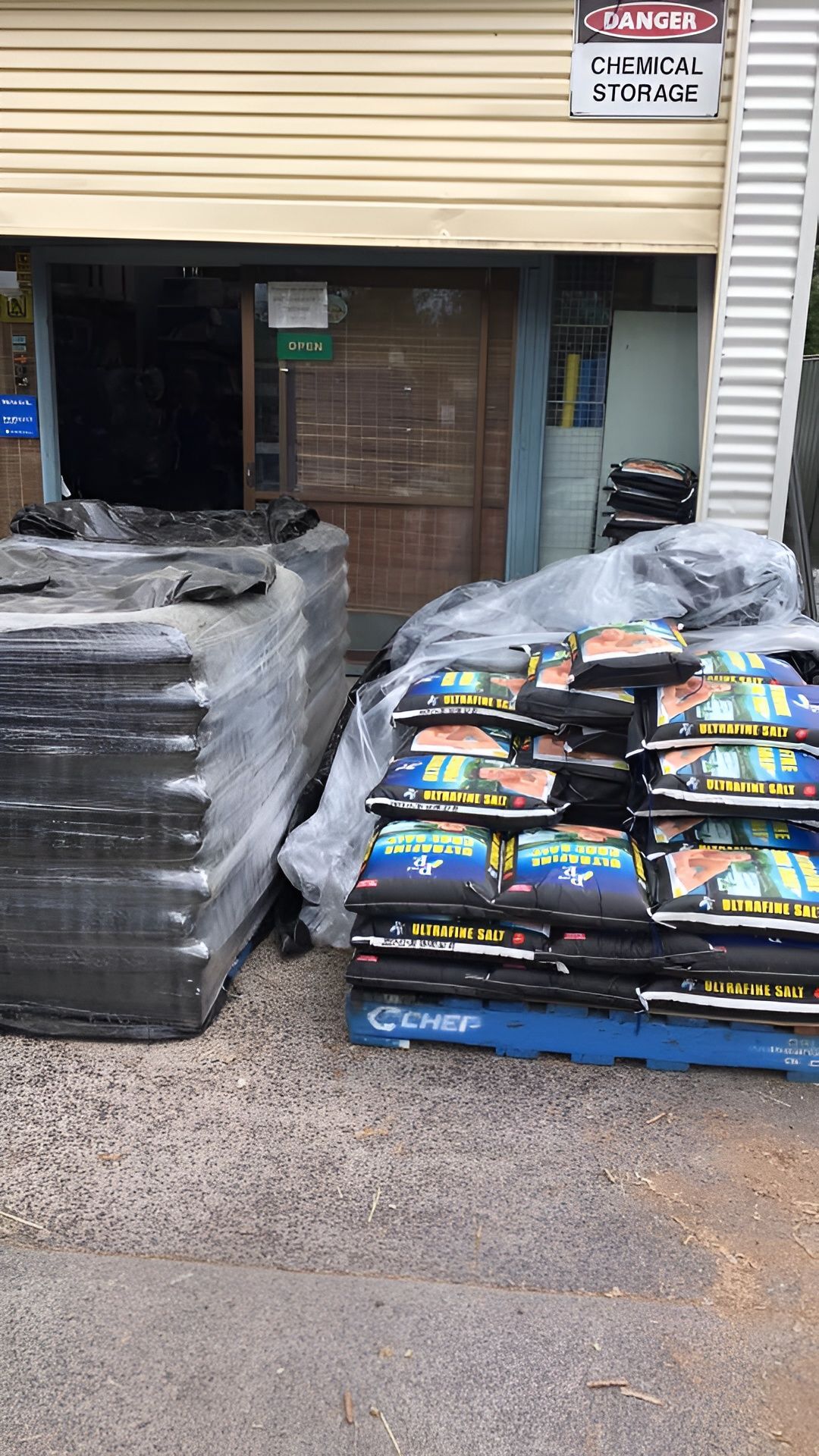 Bags of Mulch Stacked on a Blue Pallet — Landsborough Pool Supplies & Service in Sunshine Coast, QLD