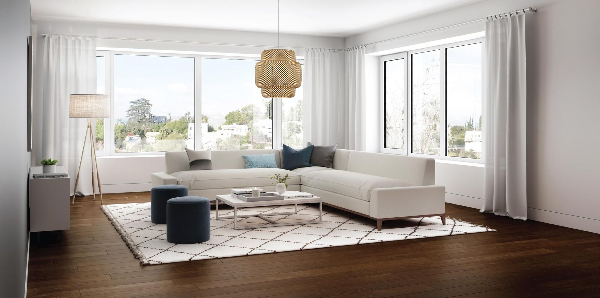 A living room with a white sectional couch , coffee table , and ottomans.