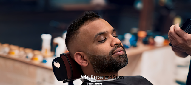 A man is getting his hair cut by a barber in a barber shop.