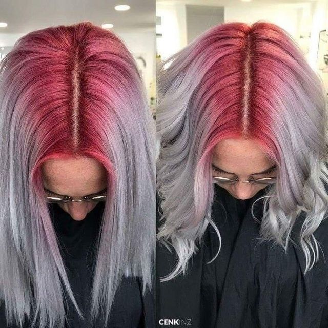 A woman with red and gray hair is wearing glasses.