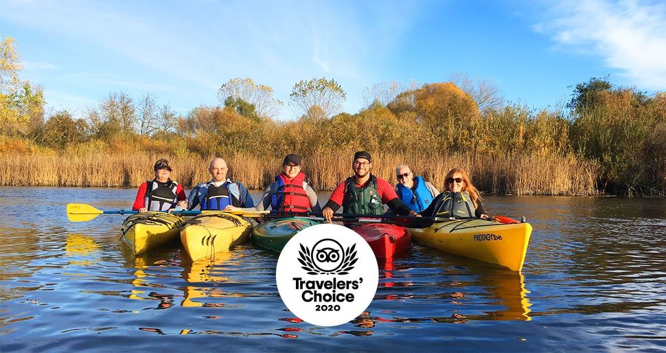 6 people sitting in kayaks