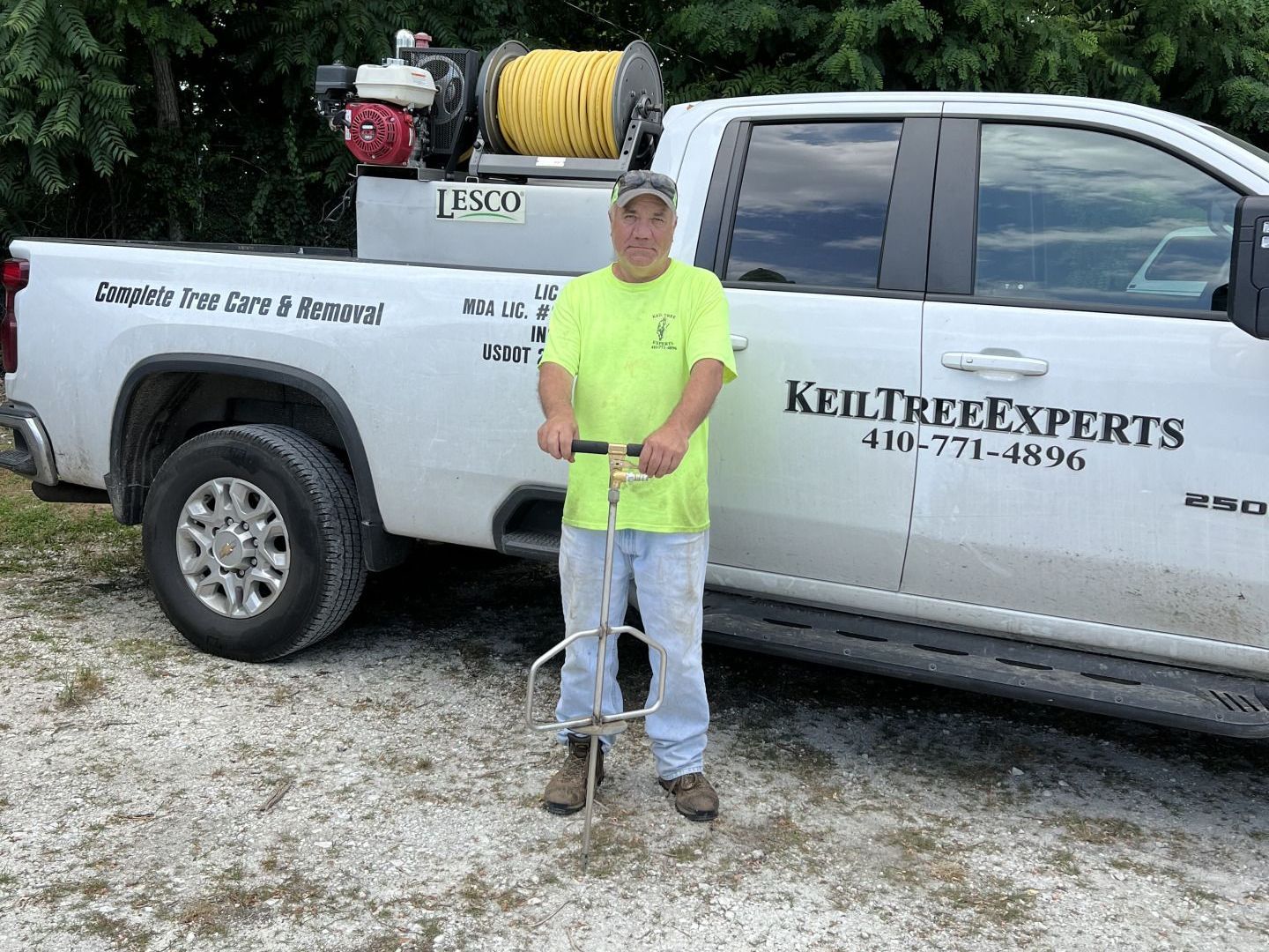 Keil Tree Expert arborist with professional equipment for deep root fertilization in Maryland