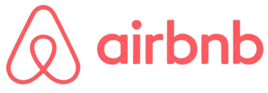 The airbnb logo is red and white on a white background.