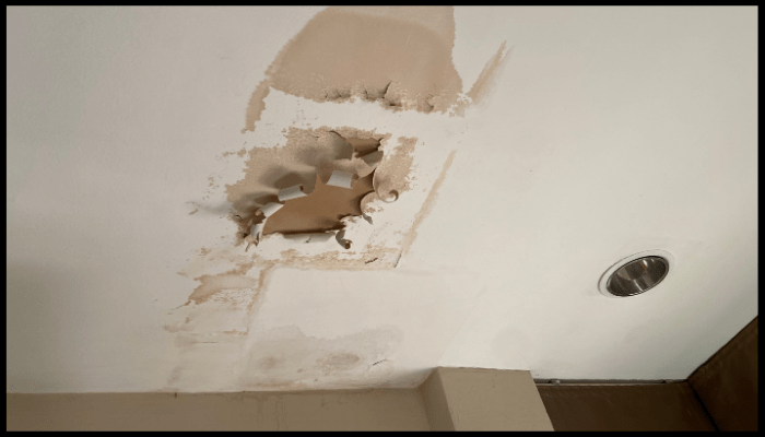 There is a hole in the ceiling that looks like a hole in the wall.