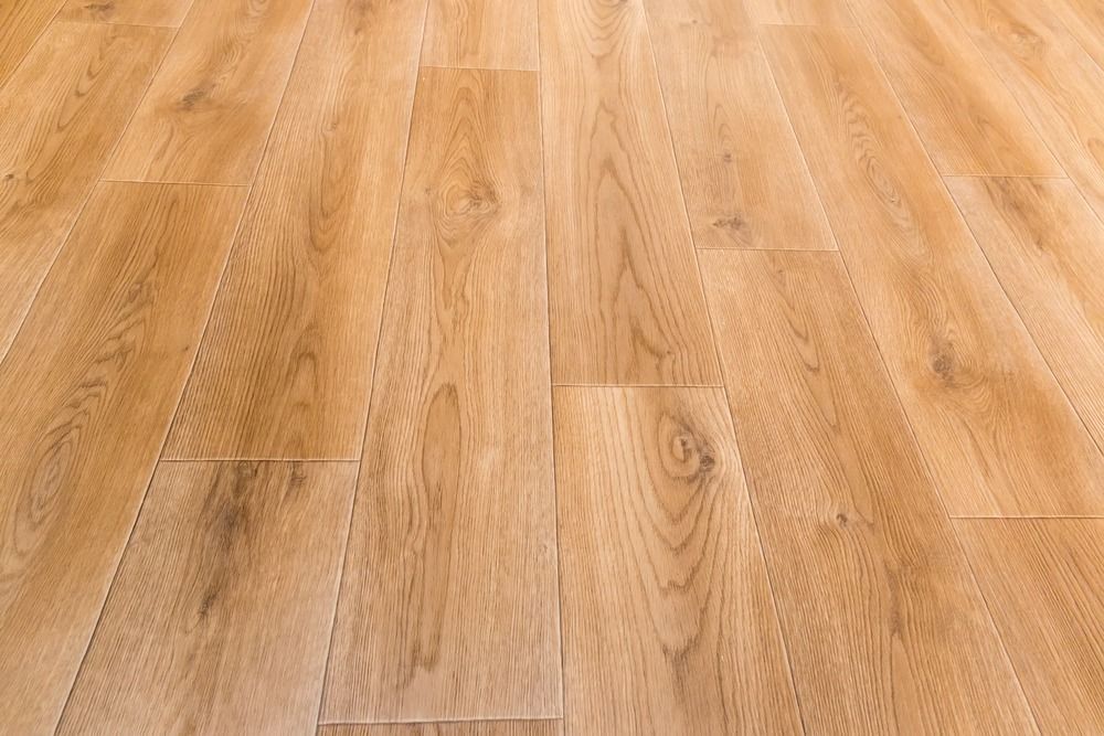 A close up of a wooden floor in a room.