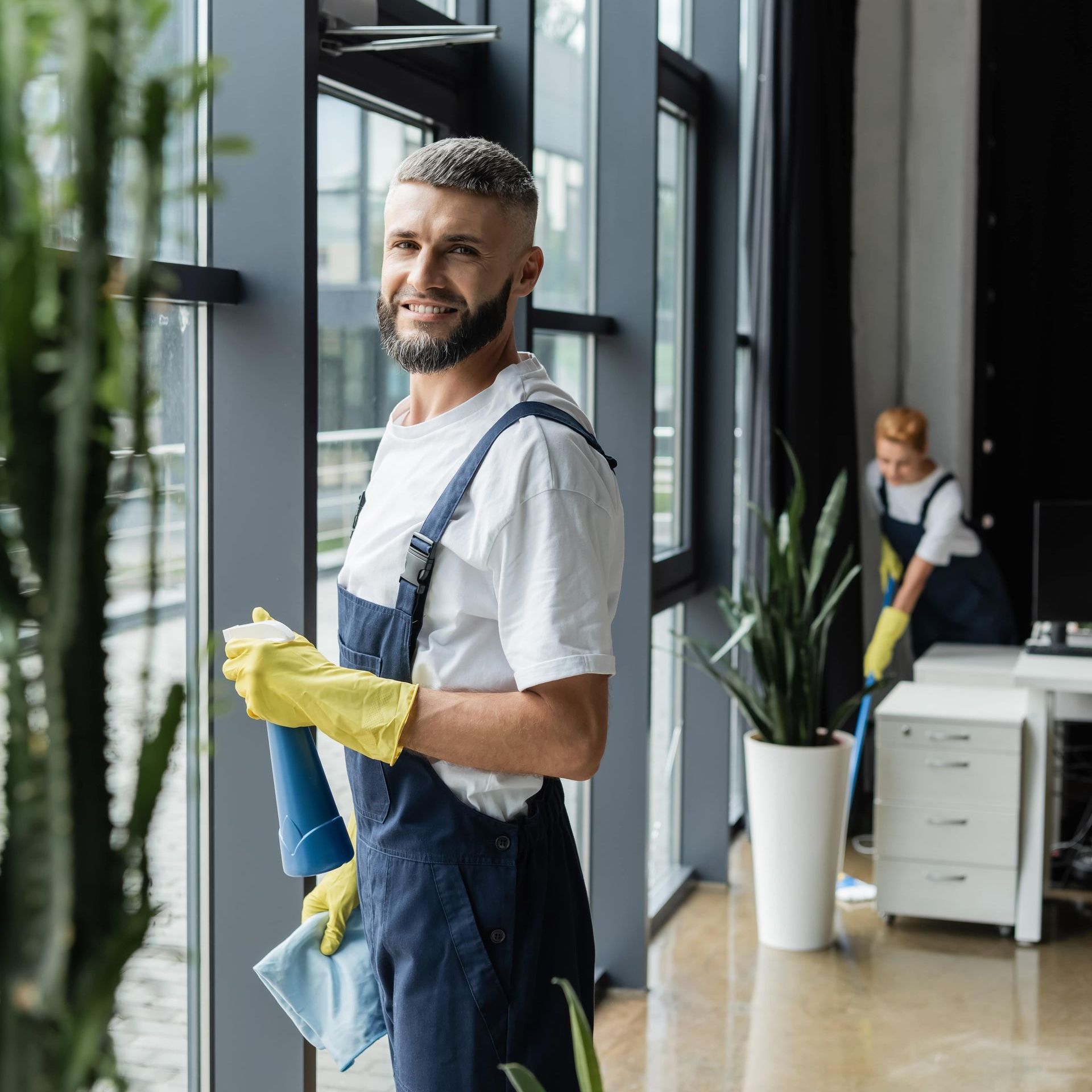 a man cleaning an office space in a commercial building