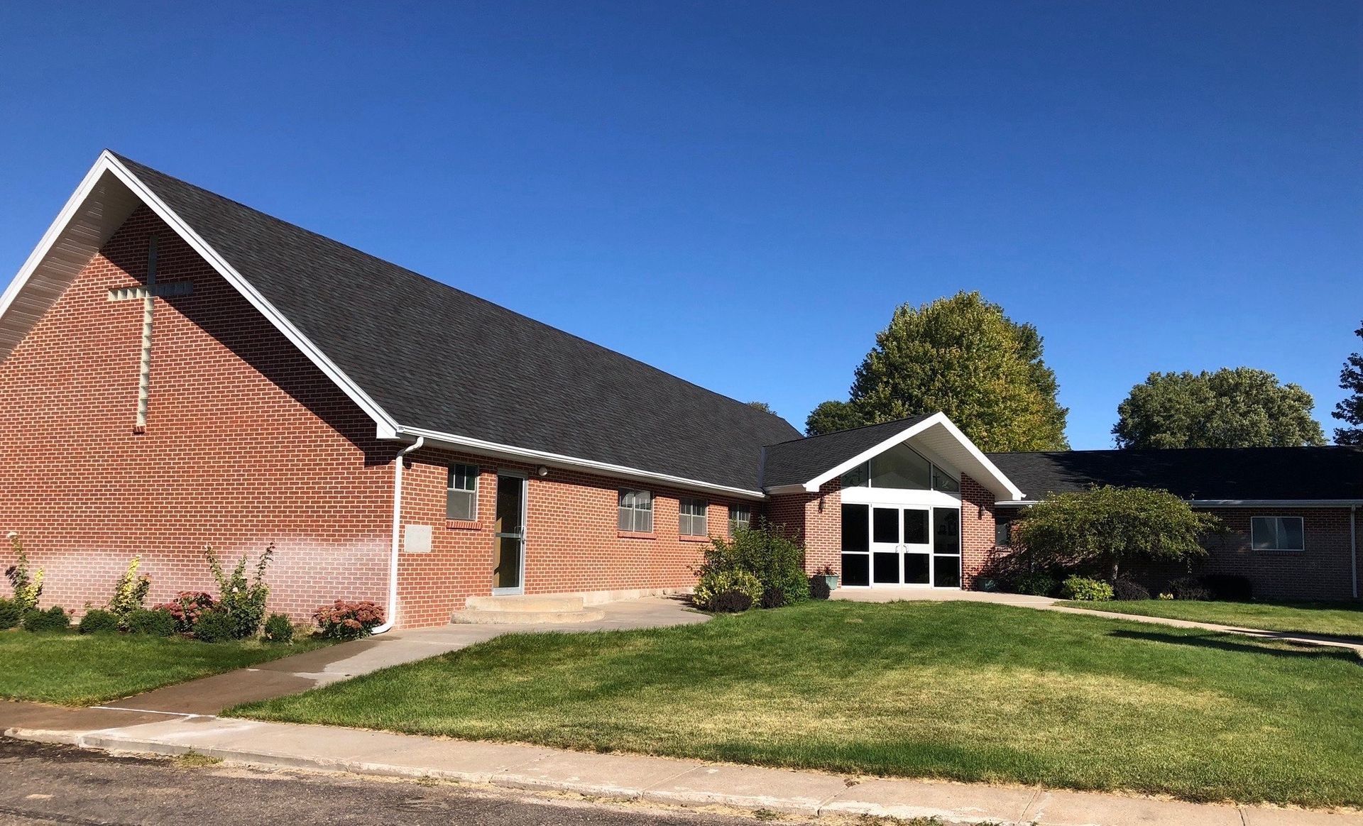 An aerial view of a house under construction with a white van parked in front of it.