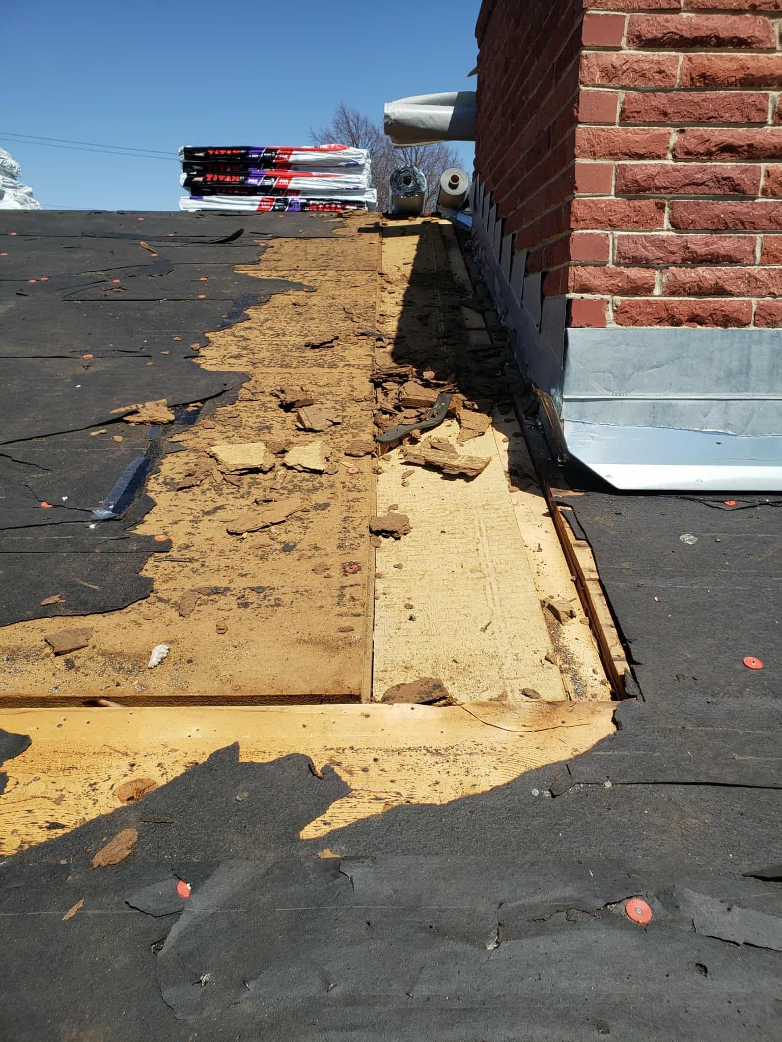 A house is being remodeled with scaffolding around it.