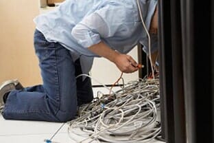 Man Configuring the Network Cable — Computer Builds in Fairfield, ME