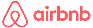 Un logotipo rojo de Airbnb sobre un fondo blanco.
