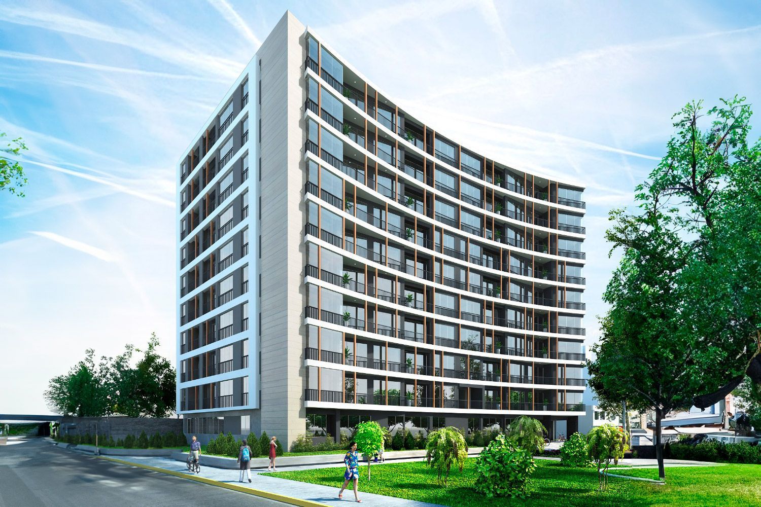 Un edificio grande con muchas ventanas está rodeado de árboles y césped.