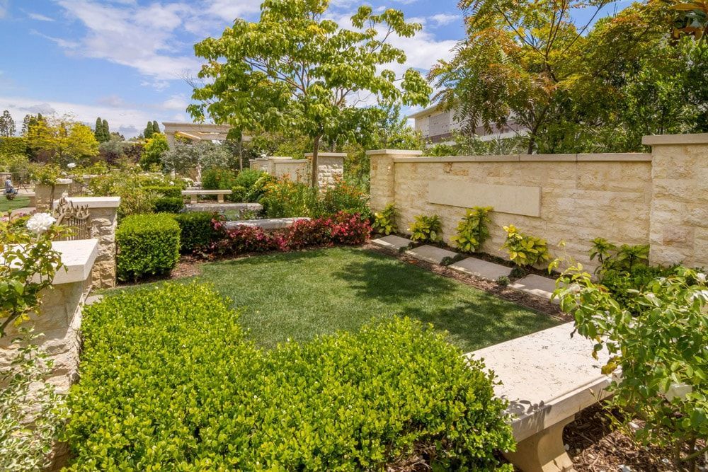 There is a bench in the middle of the garden.