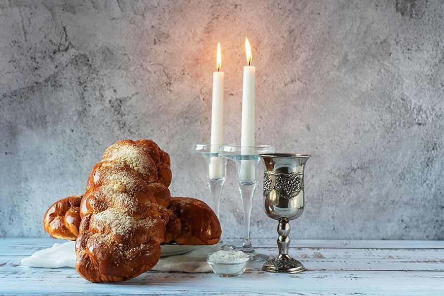 There are candles and bread on the table.