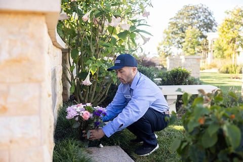 Staff worker delivering flowers at Hillside Memorial Park