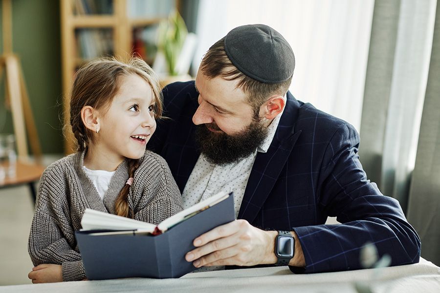 Jewish Parent with Child reading