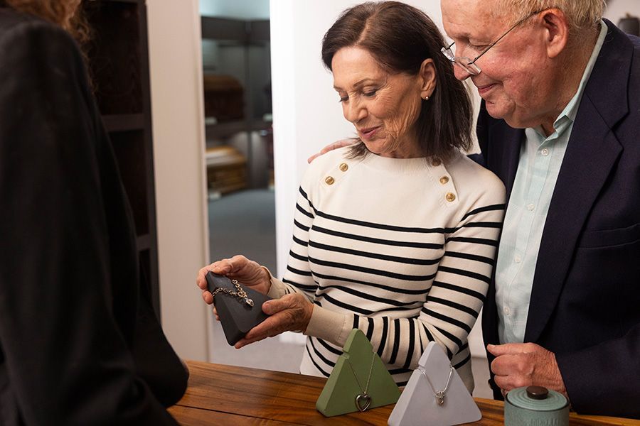 Couple looking over memorial keepsake options