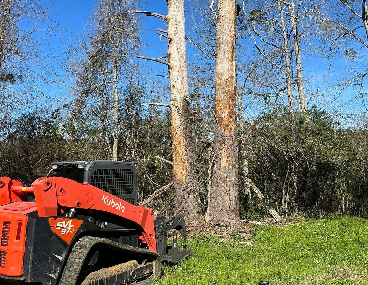 Mini excavator bucket in a trench at a construction site 
