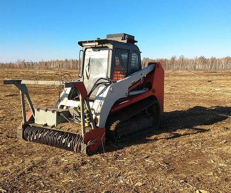 forestry mulcher in a forest clearing