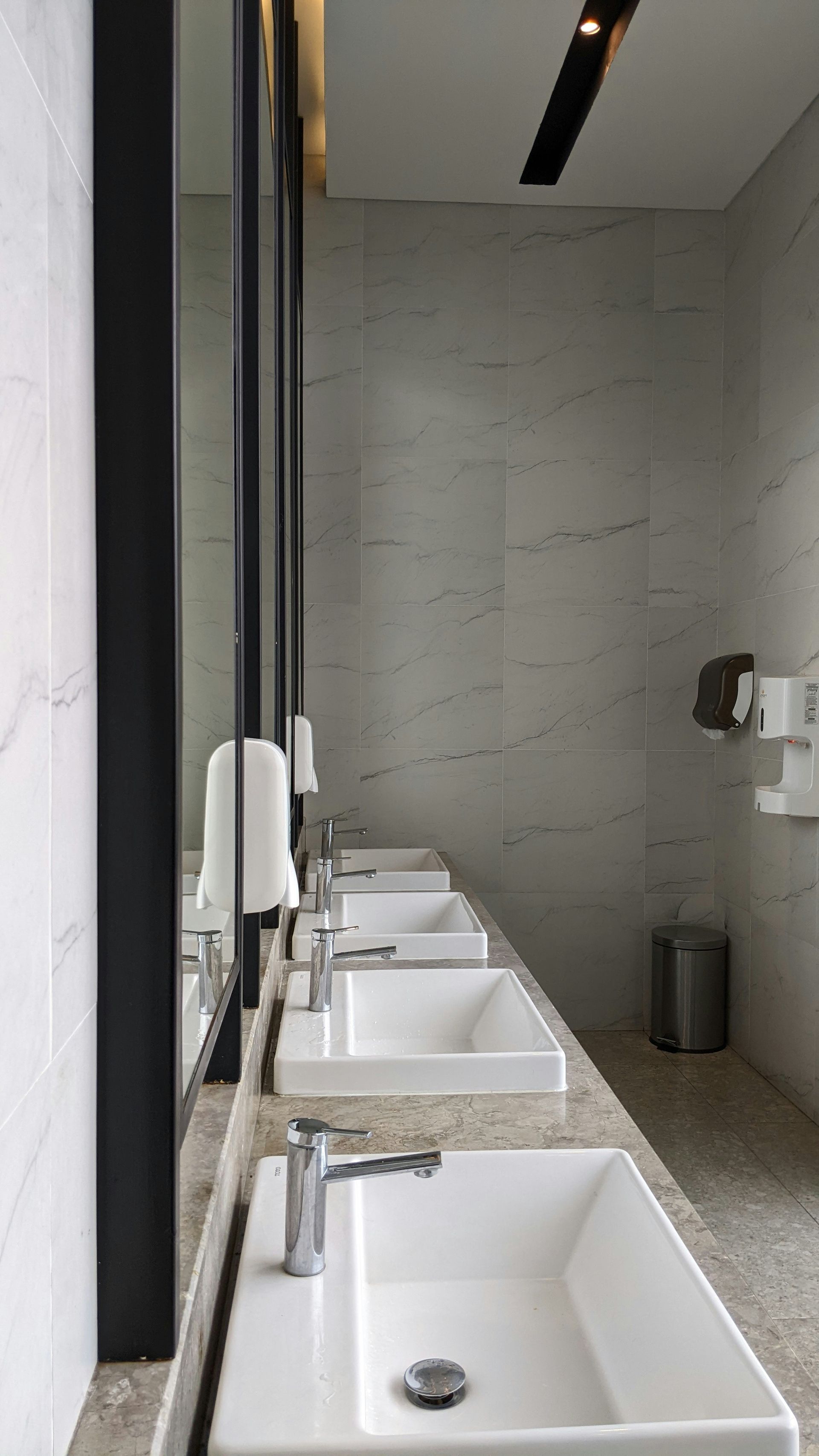 A Person Is Using An Air Freshener On A Toilet — Aafco Hygiene In Wodonga, VIC