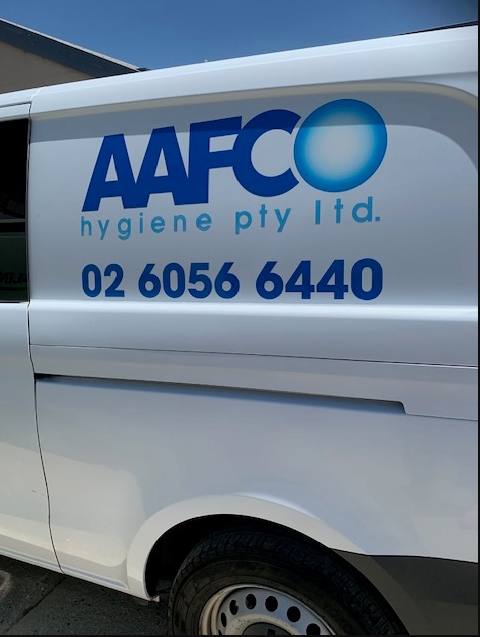 A Person Is Cleaning A Couch With A Vacuum Cleaner — Aafco Hygiene In Wodonga, VIC