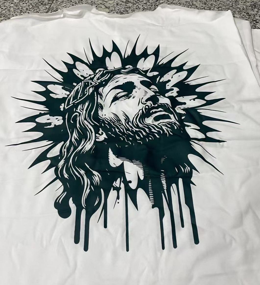 A white shirt with a picture of jesus on it