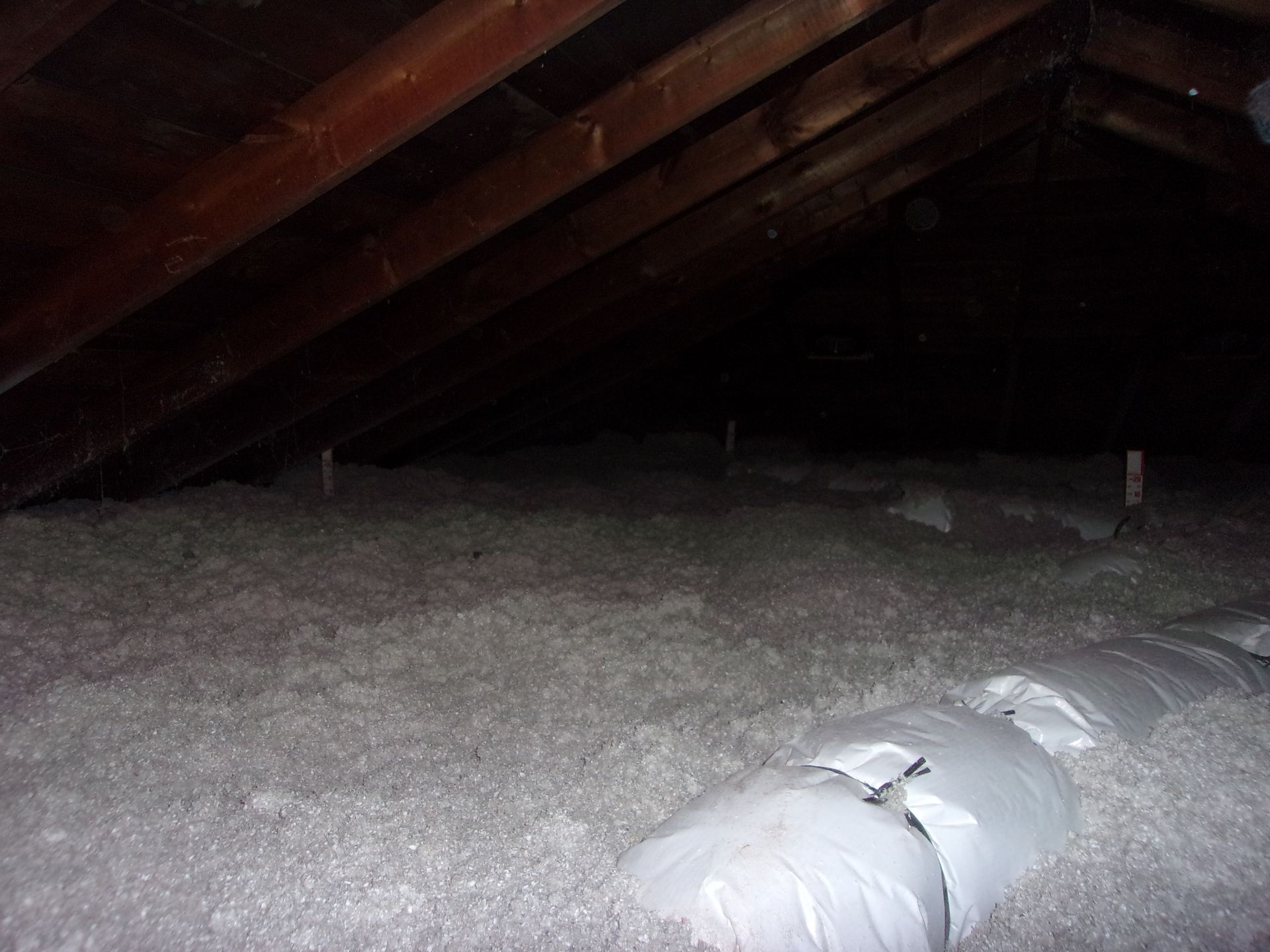Attic covered properly in loose fill cellulose insulation