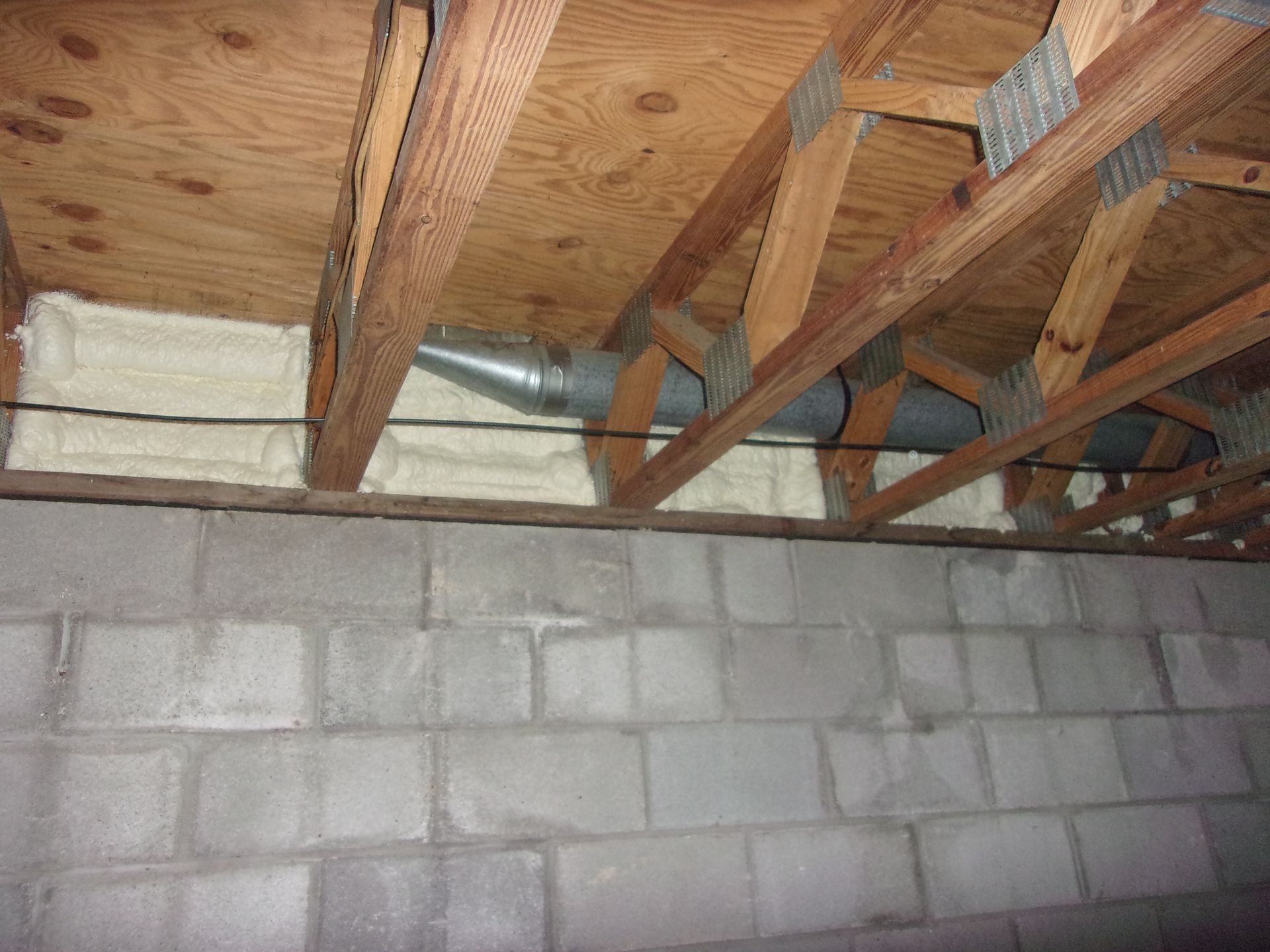 Spray foam insulation in the rim joists of a basement