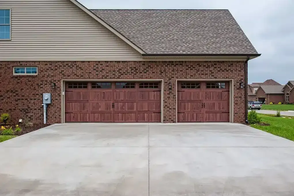 Carriage-style garage doors, double and single wide, made out of wood