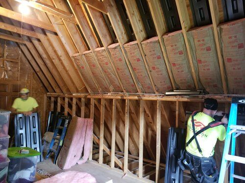 Fiberglass insulation in an attic by Unified Insulation Systems