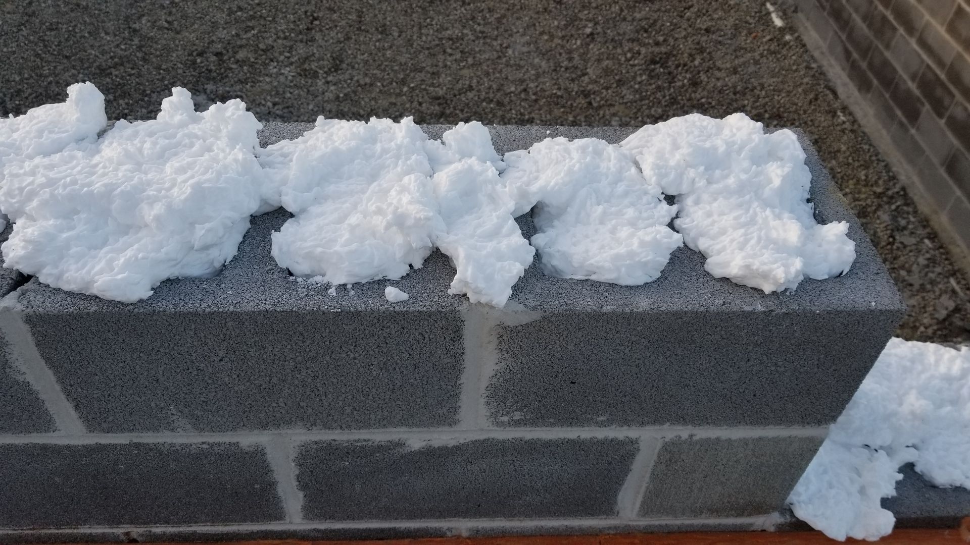 Block foam inside cinderblock basement insulation.  Block foam has an r value of 5 per inch!