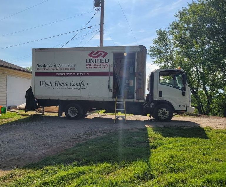 Unified Insulation Systems truck insulating a residence in Canton, Ohio.  The sun is shining and its a beautiful spring day!