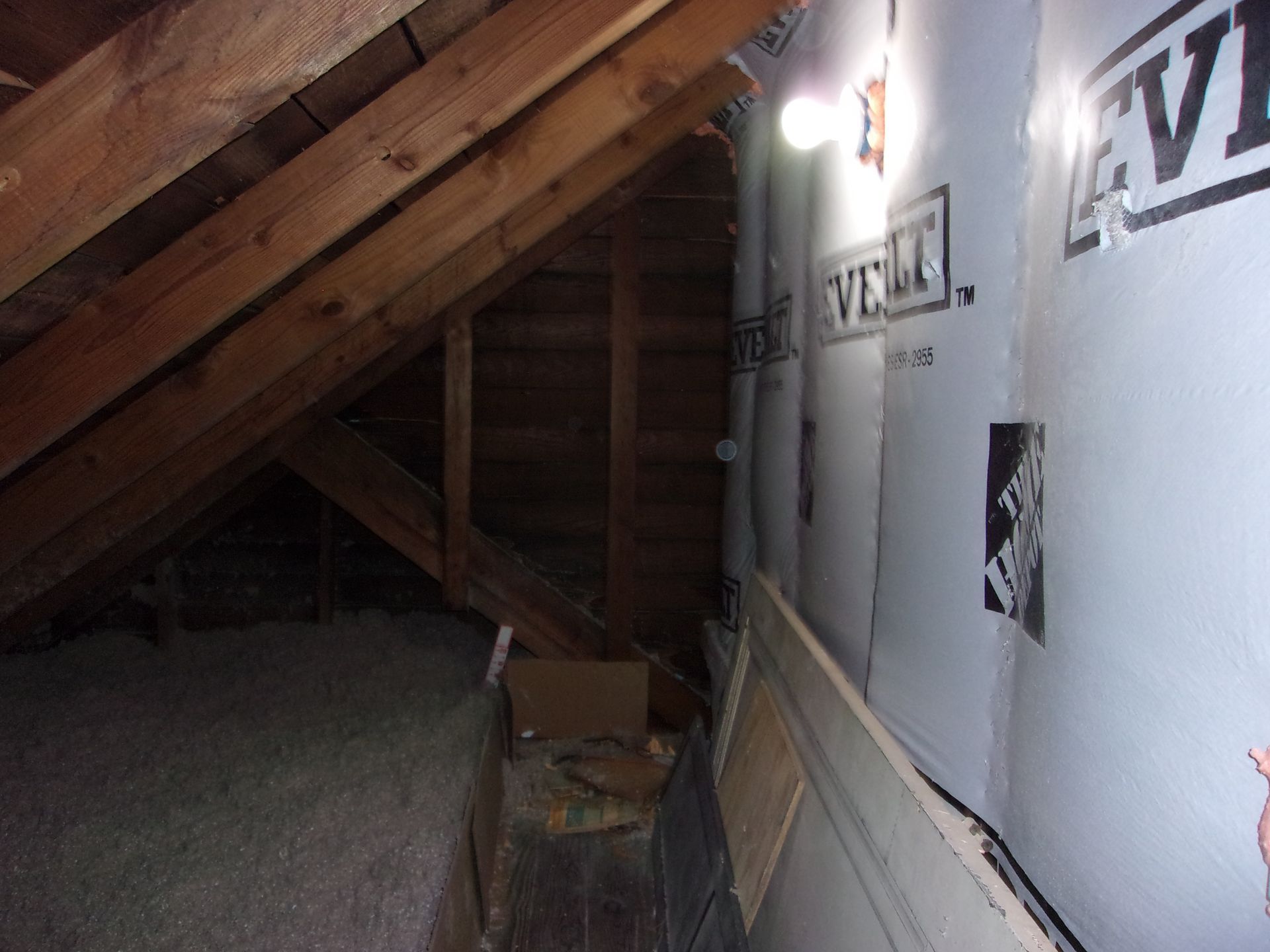 Half complete attic eave insulation with an air barrier