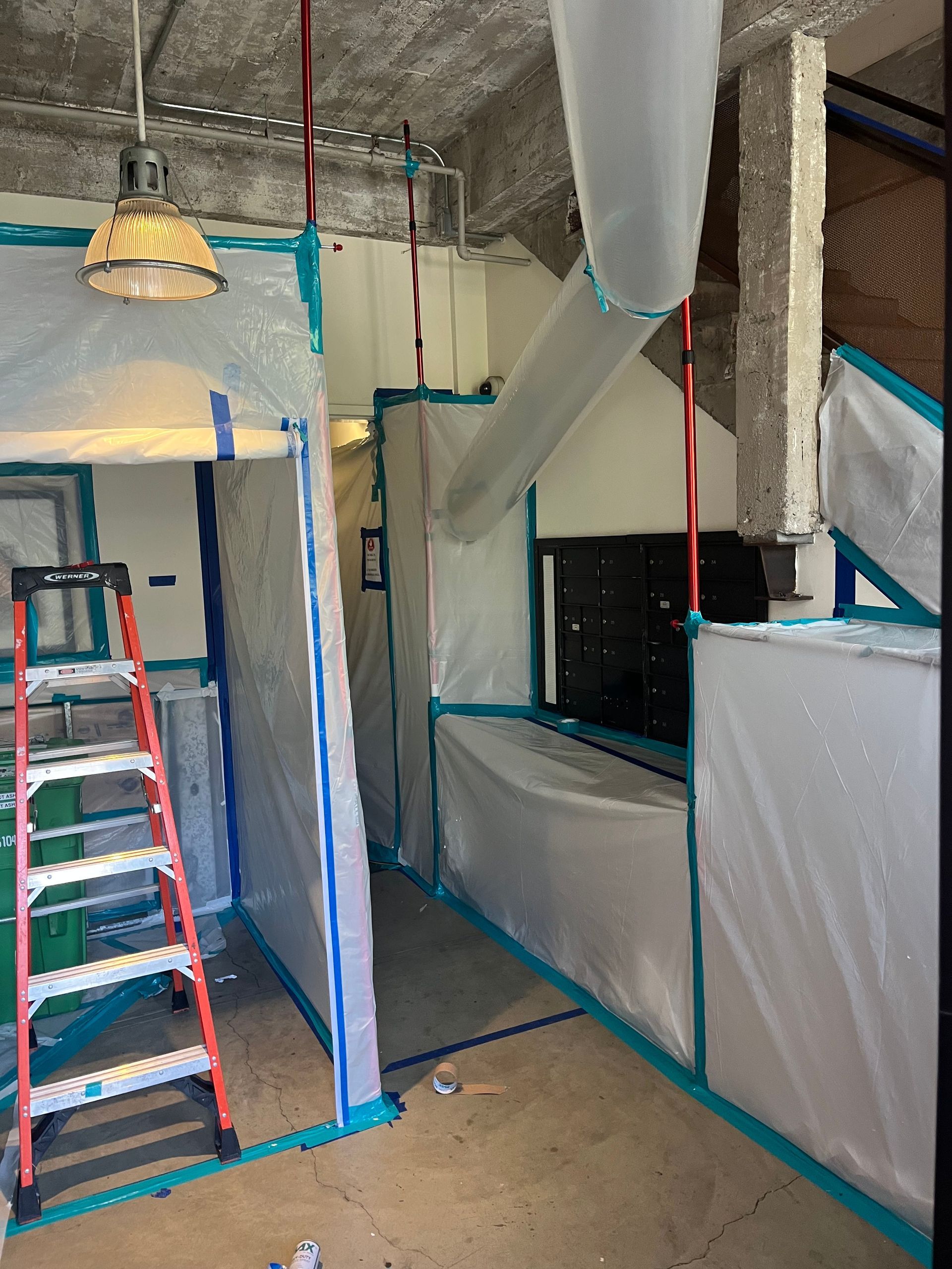 A room with a ladder and a ladder in it