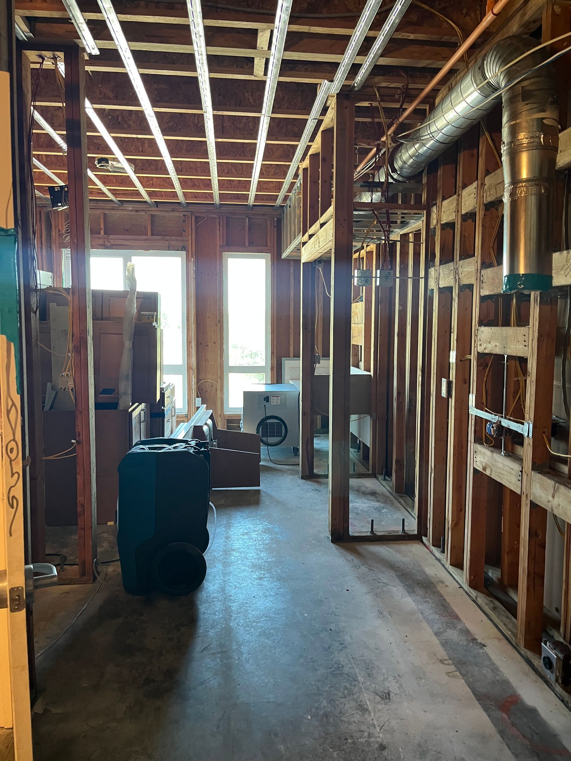 A very long hallway in a house under construction