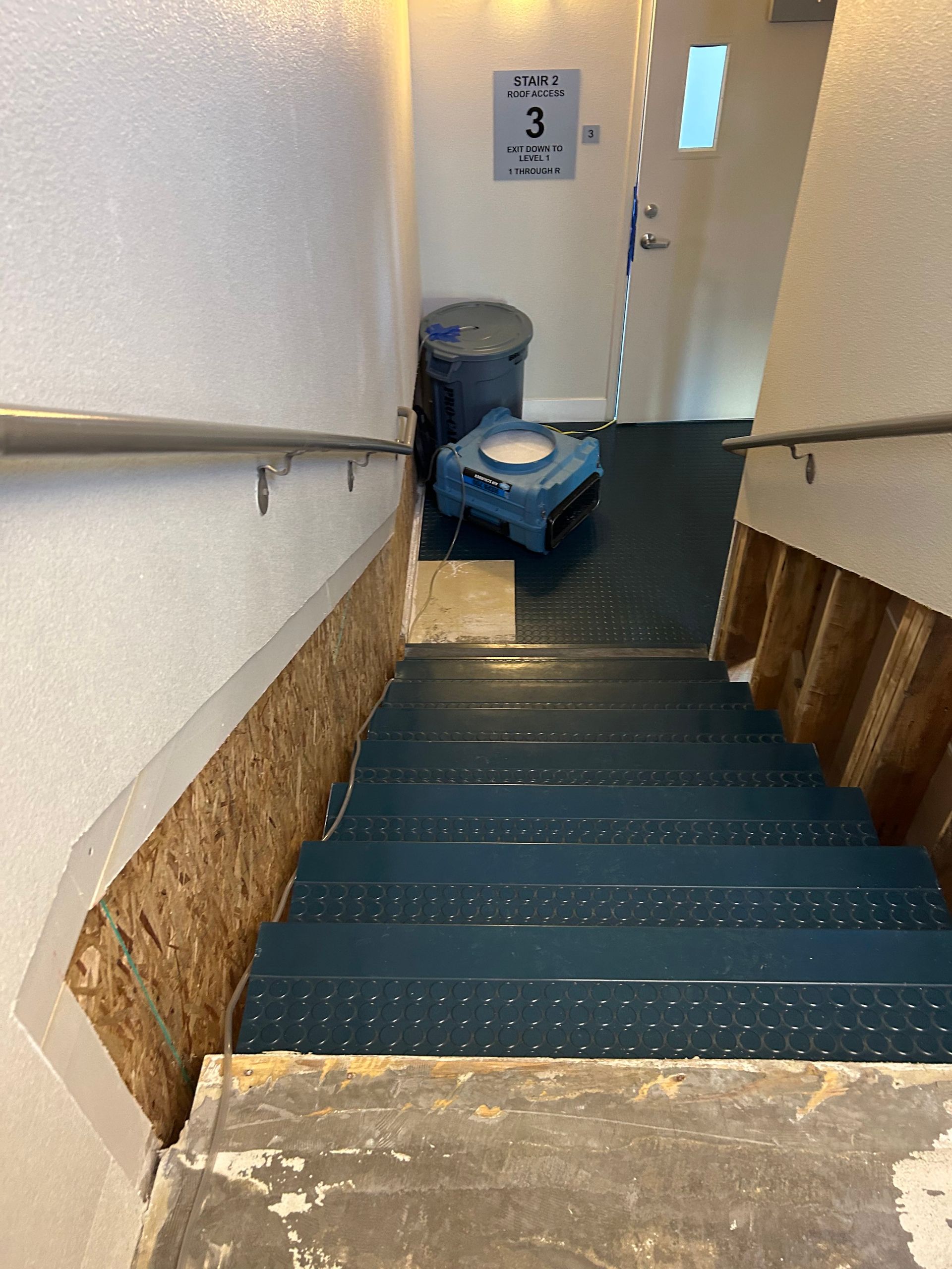 A staircase with the number 3 on the wall