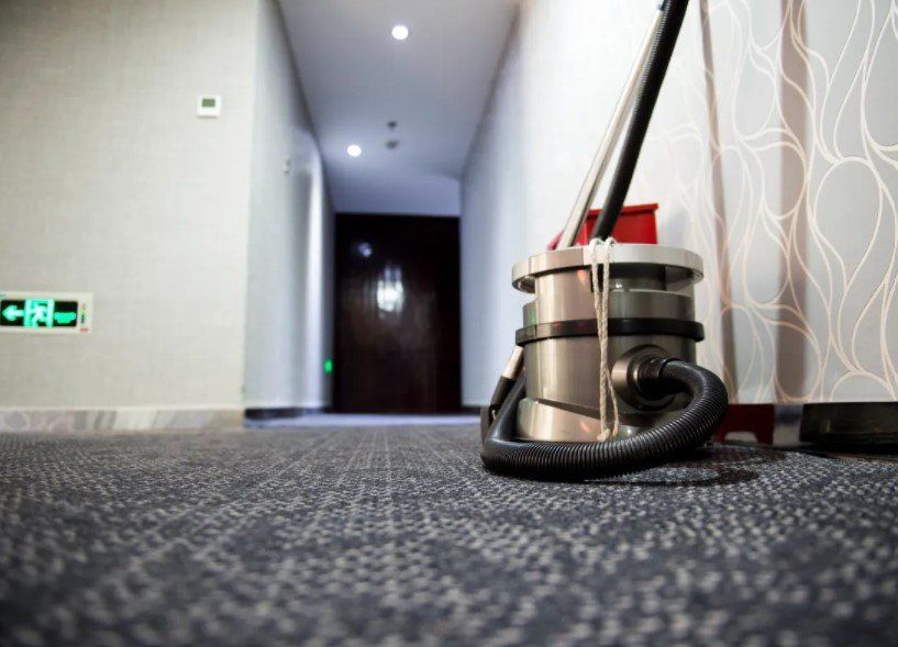 Vacuum Cleaner On For The Carpet On Hallway — Garden City, KS — Southwest Janitorial Service