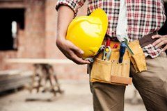 Worker Holding Construction Helmet - Superior Siding & Gutters in Norfolk, VA