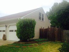 Side View of Home with Garage Doors - Siding Repair in Norfolk, VA