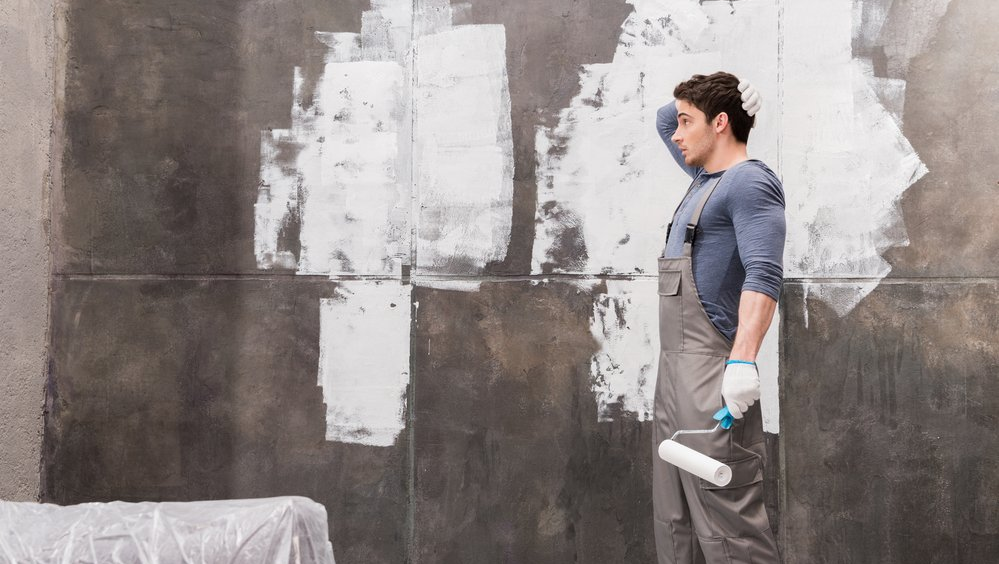 Man unsure about painting a wall