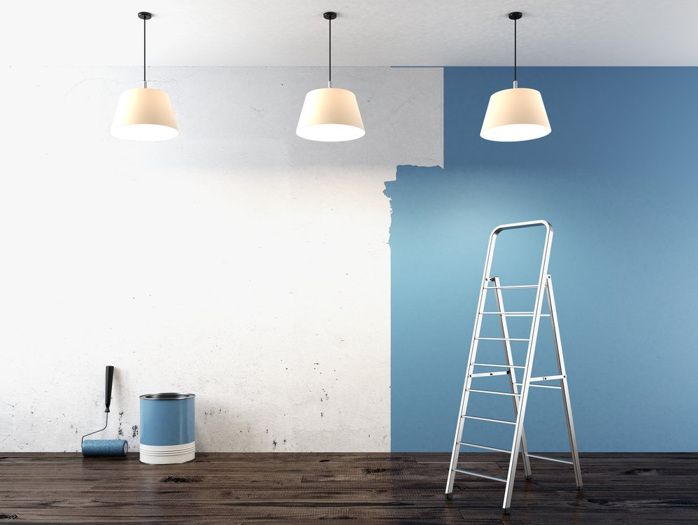 Painting a wall with three light fixtures
