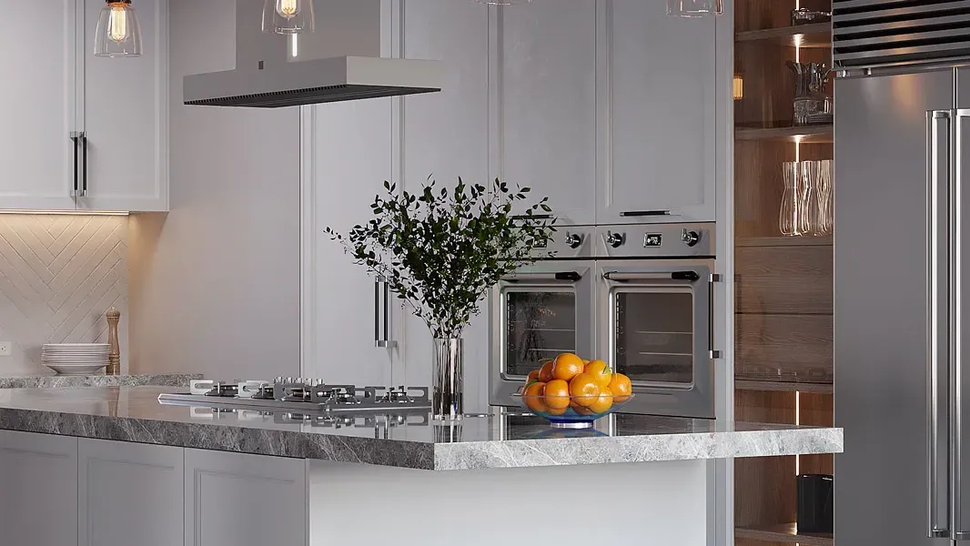 A kitchen with white cabinets , stainless steel appliances , a refrigerator and a stove