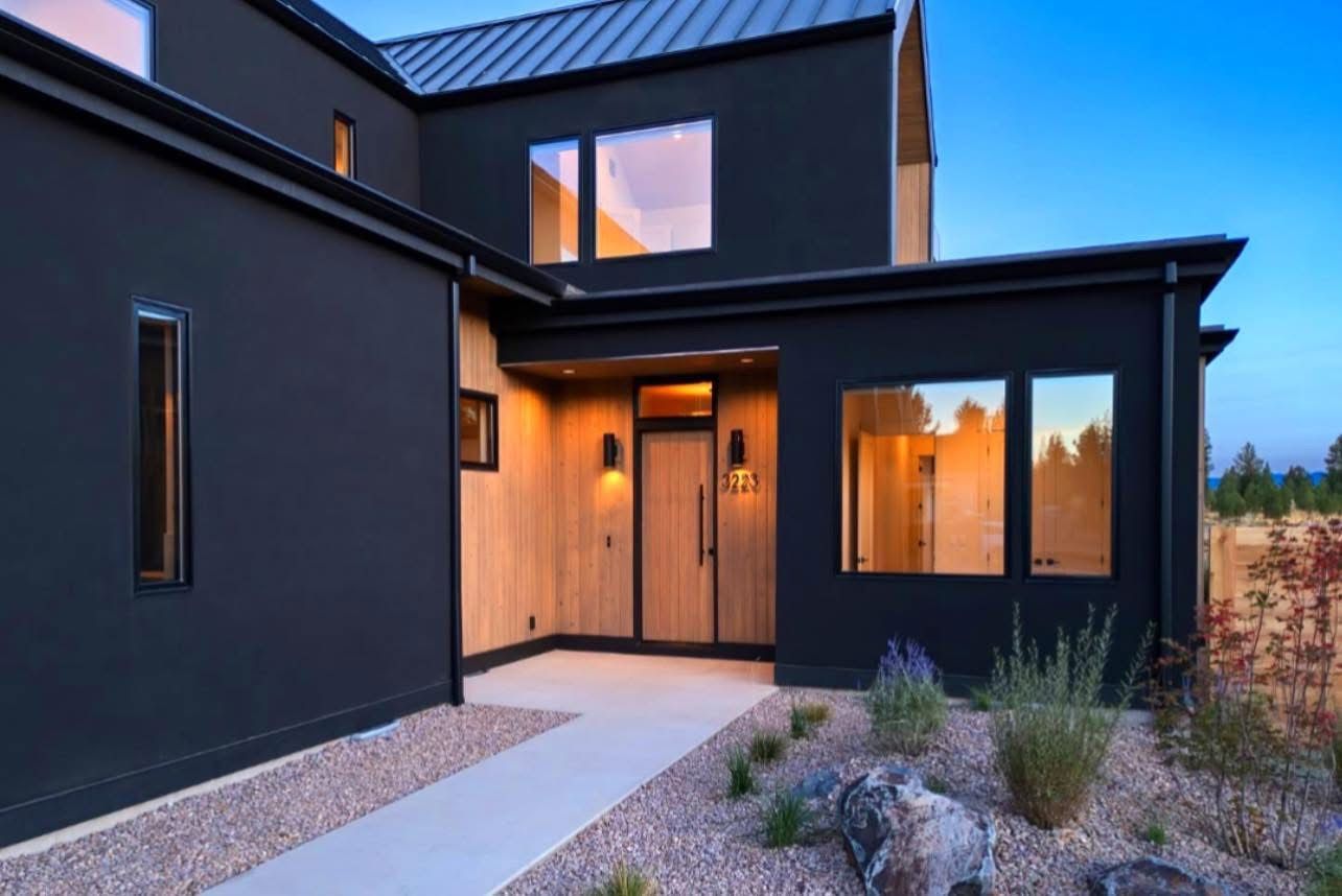 An aerial view of a patio with furniture and a fireplace.