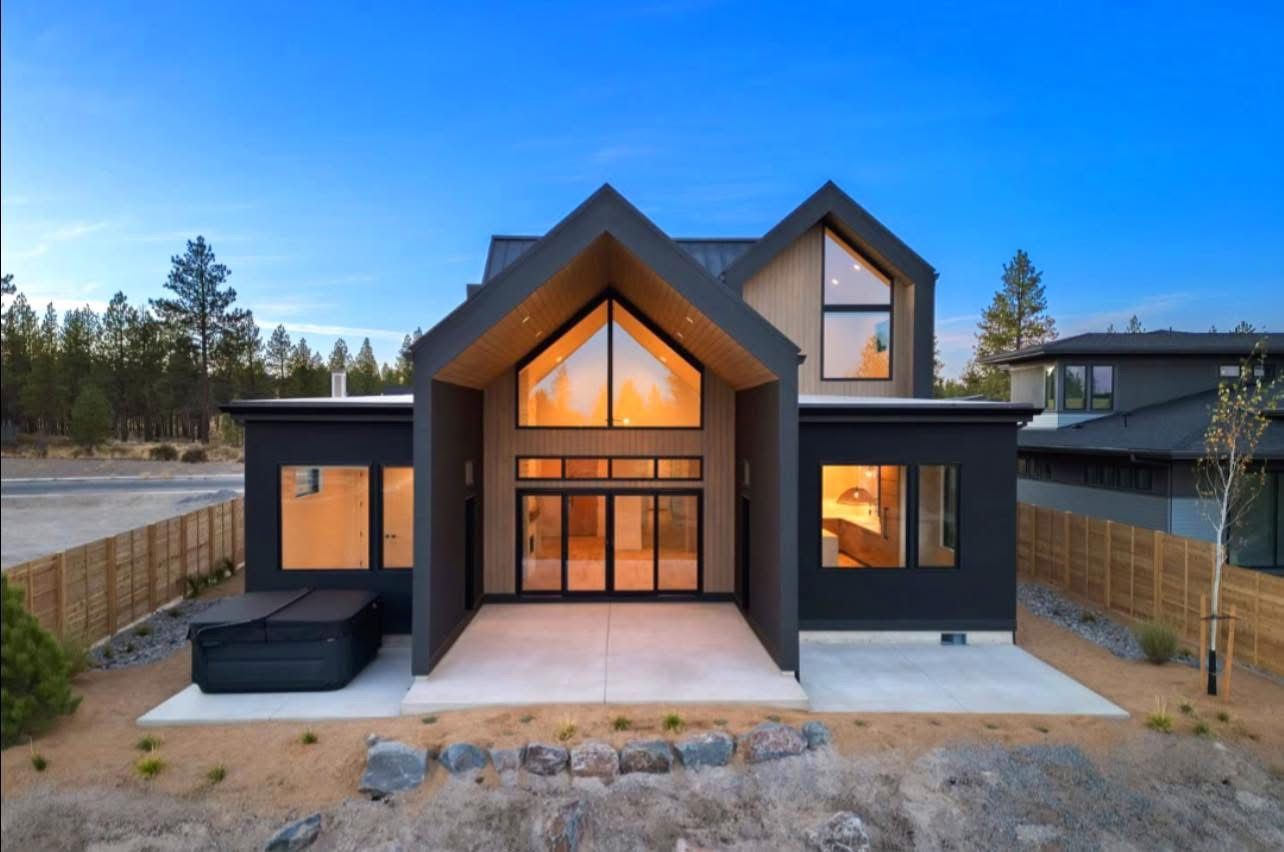 A large house with a hot tub in the backyard